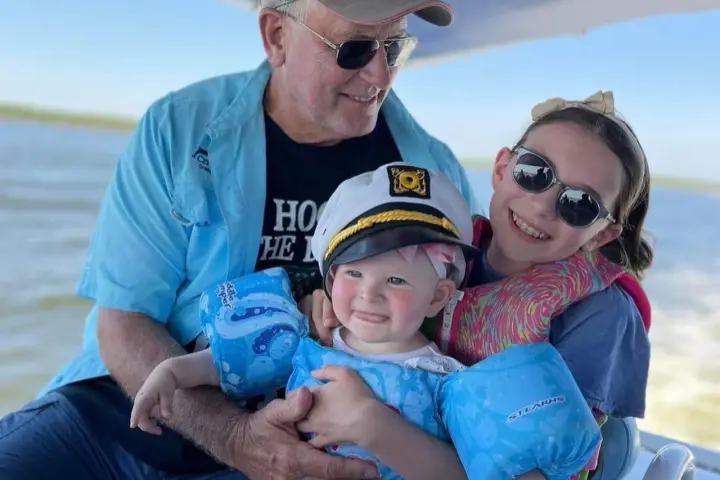 a group of people sitting on a boat