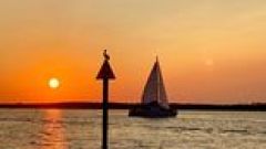 a sunset over a body of water