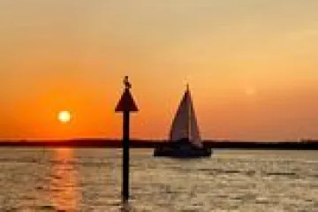 a sunset over a body of water