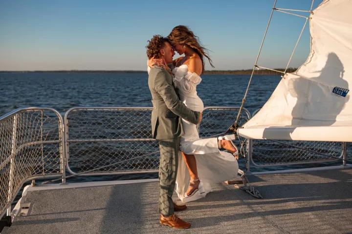 a person standing in front of a body of water