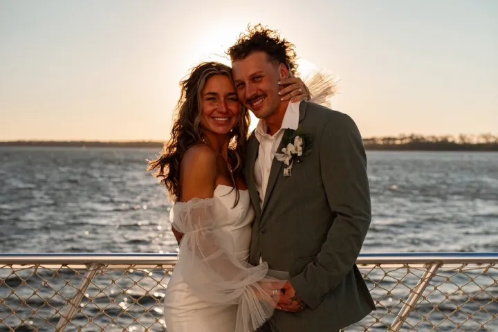 a person standing in front of a body of water