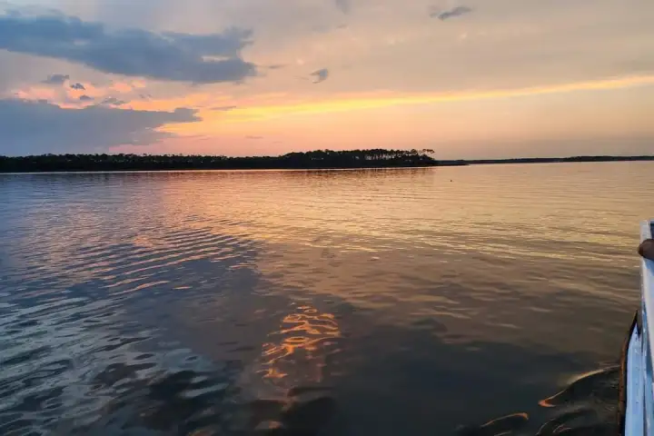 a sunset over a body of water