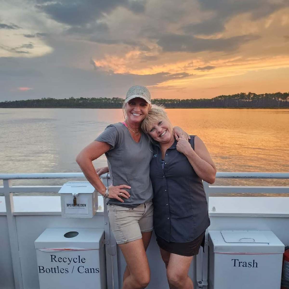 boat crew posing sunset