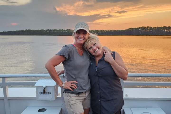 boat crew posing sunset