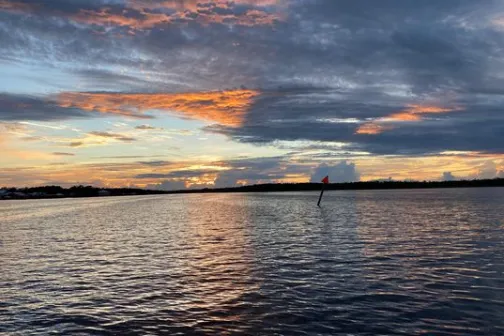 a sunset over a body of water