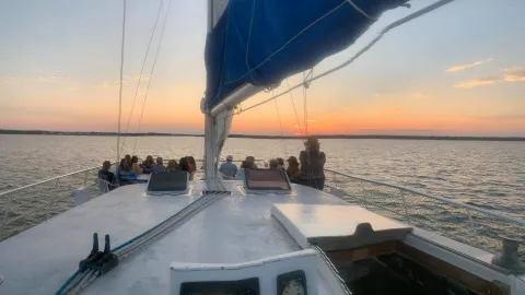 a close up of a boat next to a body of water