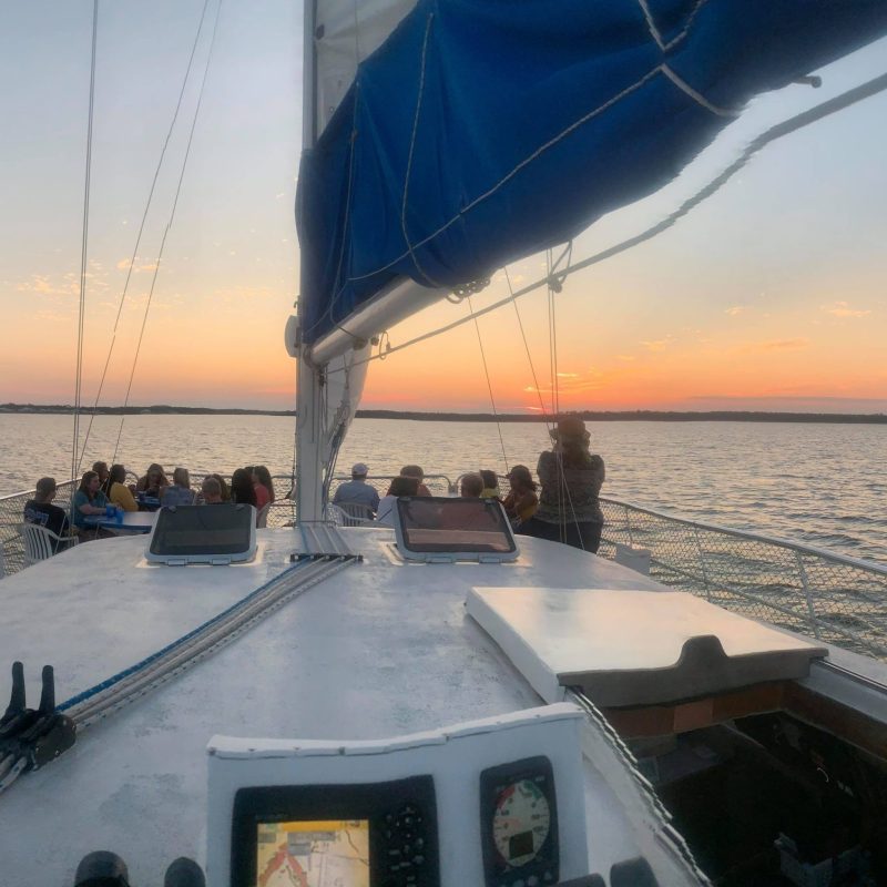 a close up of a boat next to a body of water