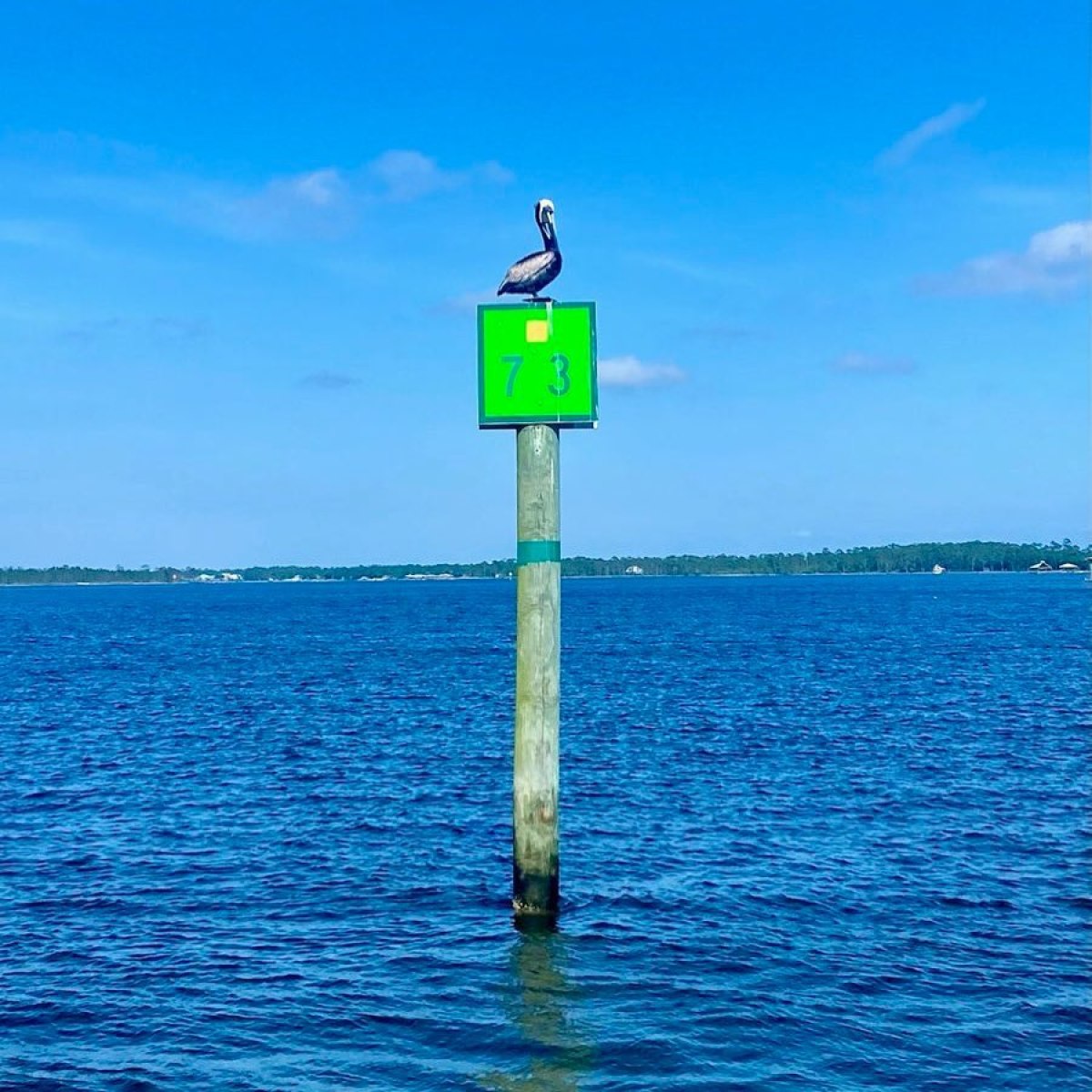 a sign above a body of water