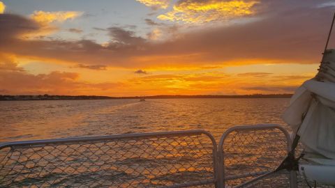 a sunset over a body of water