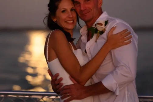 a man and a woman looking at the camera