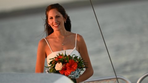 a woman sitting at a beach