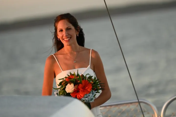 a woman sitting at a beach