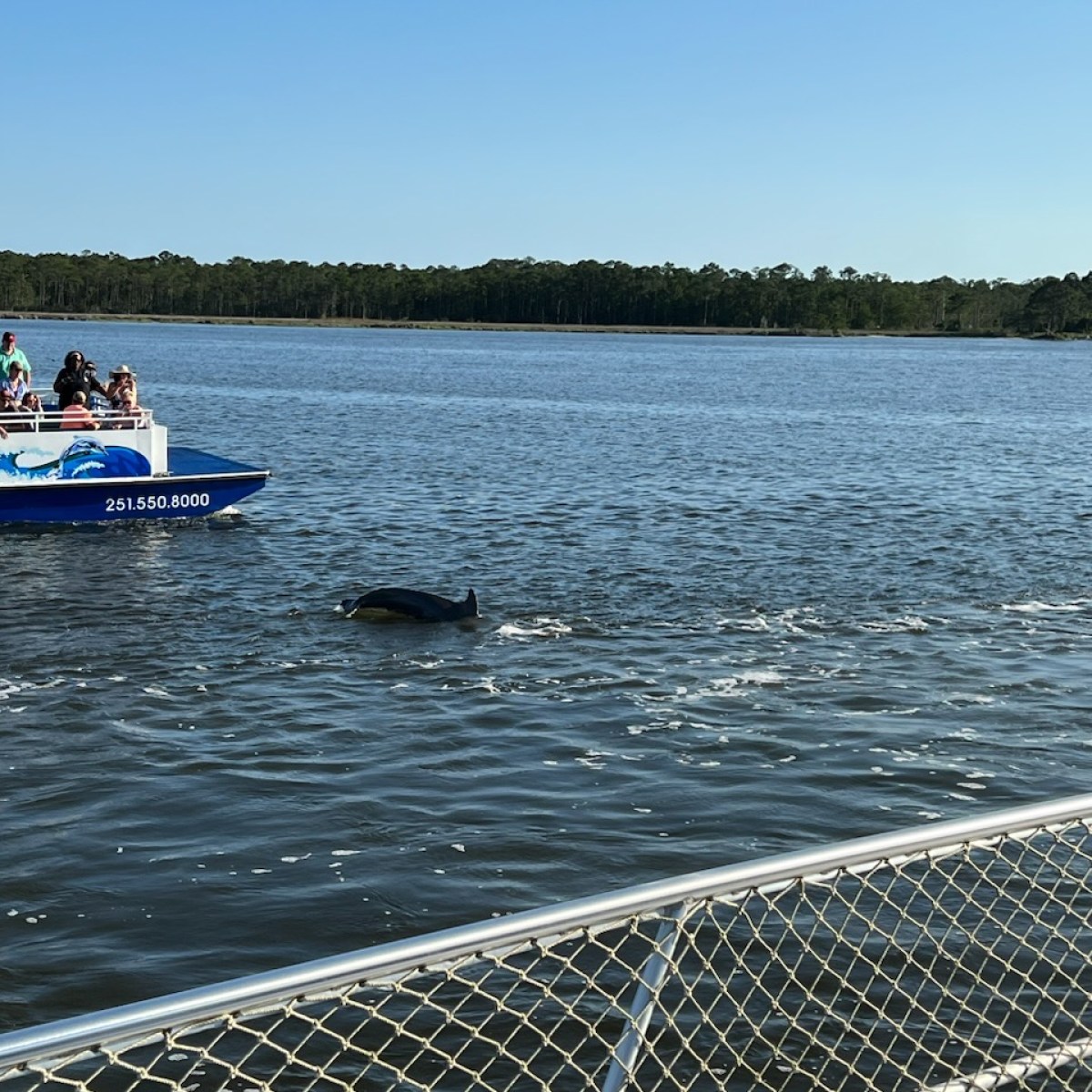 a group of people in a boat on a body of water