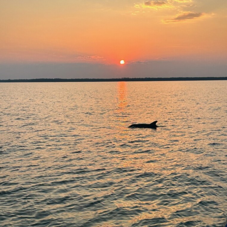 a sunset over a body of water