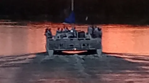 a small boat in a body of water